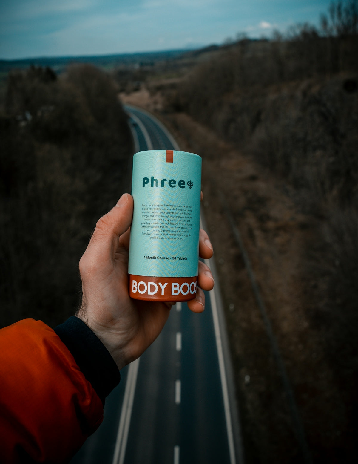 person holding white and blue labeled can