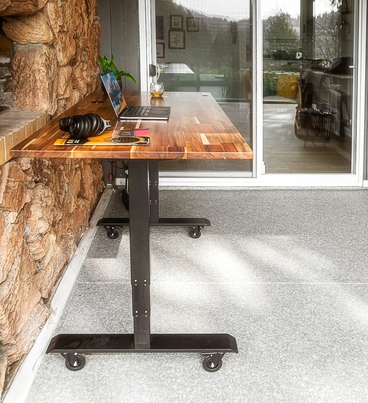a wooden table with a laptop on top of it