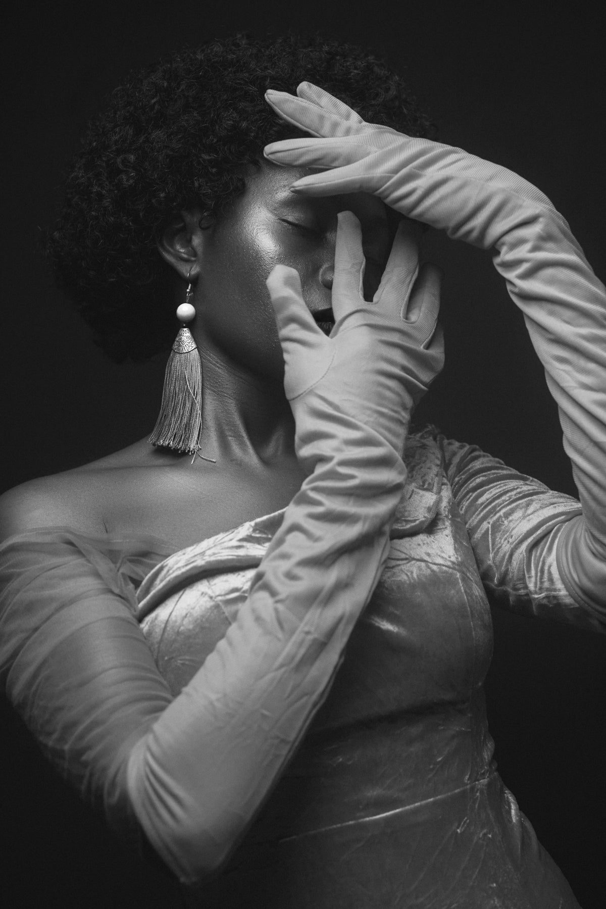 a woman in a white dress and long gloves